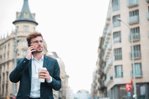 businessman-holding-standing-street-holding-takeaway-coffee-cup-hand-talking-mobile-phone